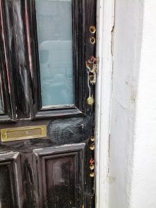 damaged door with holes