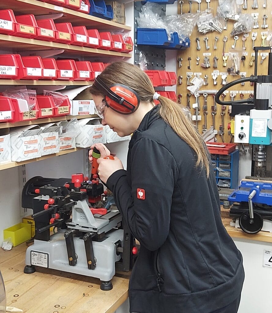 Female Locksmith Jessica Calpin Cutting Keys